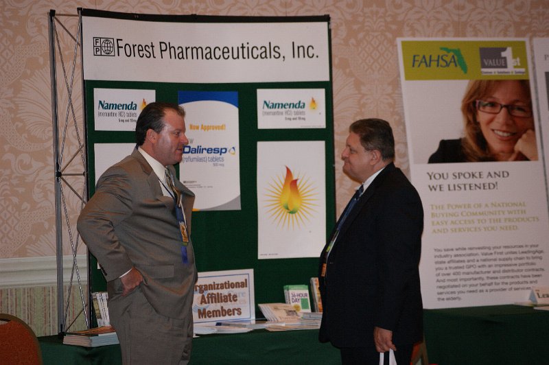 DSC04959.JPG - of the Board Dr. John Potomski (right) visits the Forest Pharmaceuticals booth.